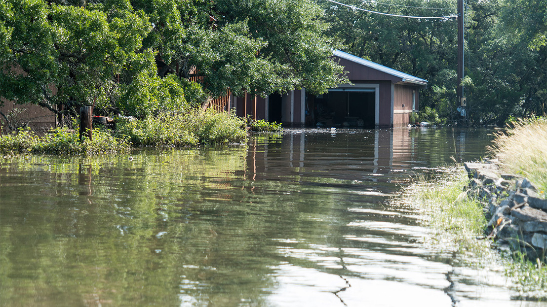 Flooded house and street in Texas.